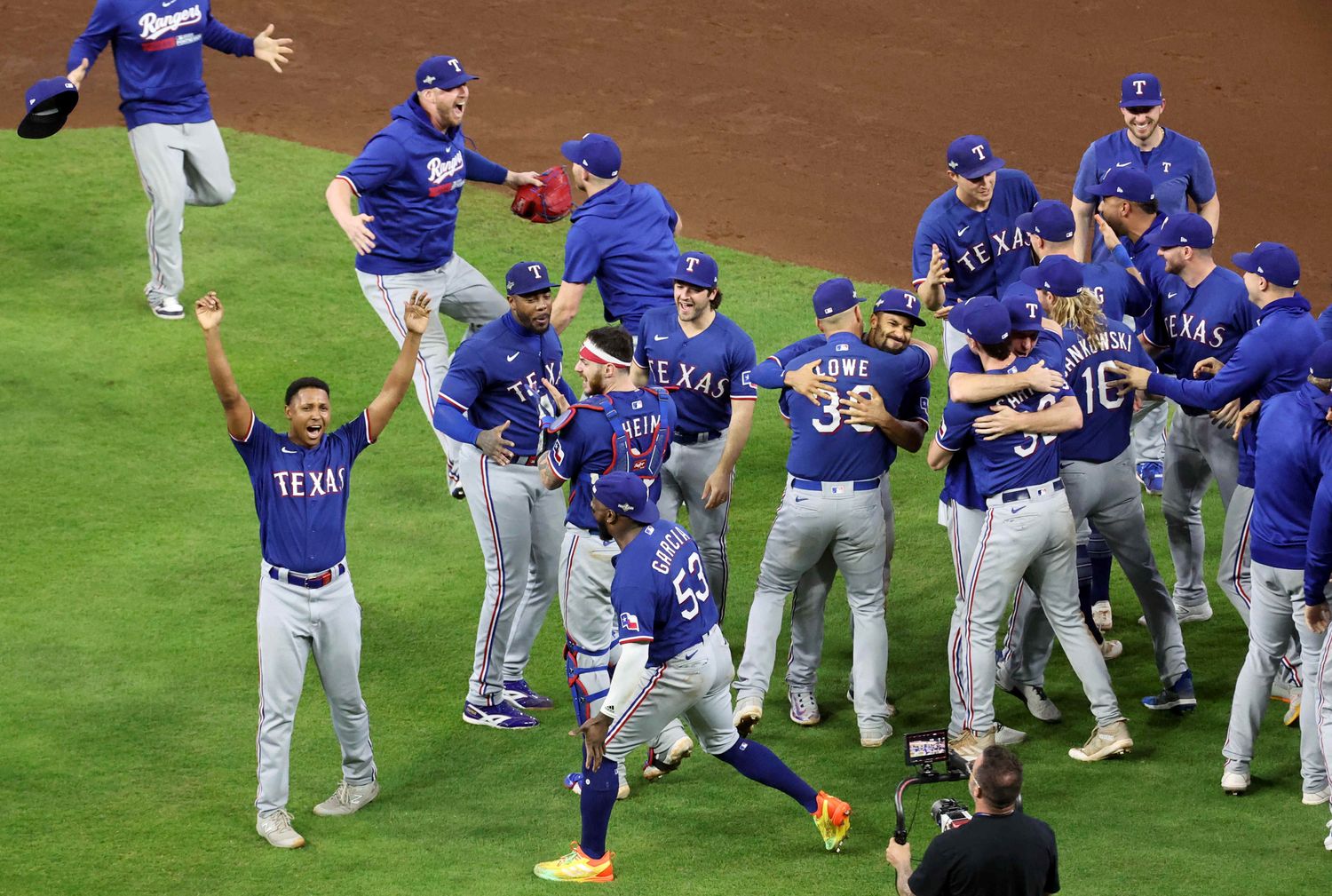 Oct 23, 2023; Houston, Texas, USA; Texas Rangers players celebrate after winning game seven in the ALCS against the Houston Astros for the 2023 MLB playoffs at Minute Maid Park. Mandatory Credit: Troy Taormina-USA TODAY Sports